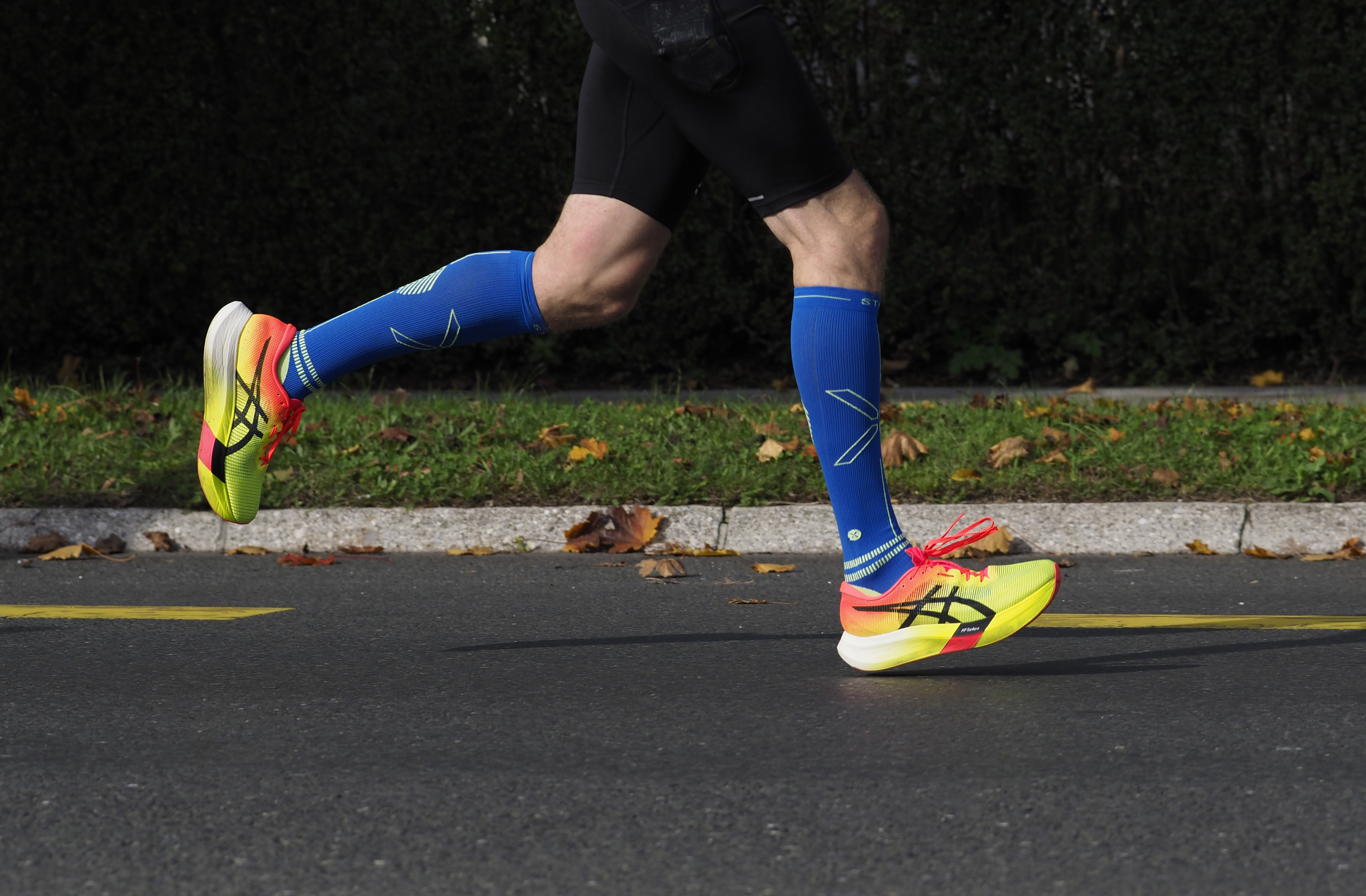 Marathon runner in part of his running gait - terminal swing to heel strike (initial contact) wearing Asics Metaspeed Edge "Paris" (2024 Ljubljana Marathon)